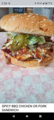 BBQ HAND PULLED CHICKEN OR PORK SANDWICH. HOUSE MADE BBQ, MELTED CHEESE & HAWAIIAN COLE SLAW ON GRILLED BUN