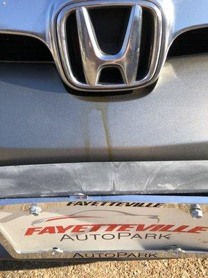 Oil dripping down front of car even after it was "cleaned."