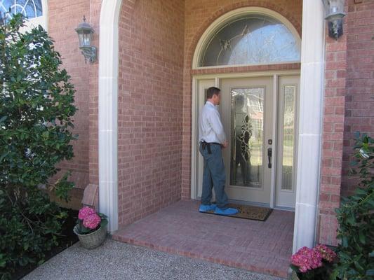 Pest and termite technicians that are careful around your property.  Notice the shoe covers?  We are the service difference.