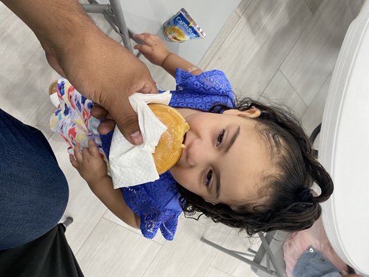 My daughter enjoying a donut