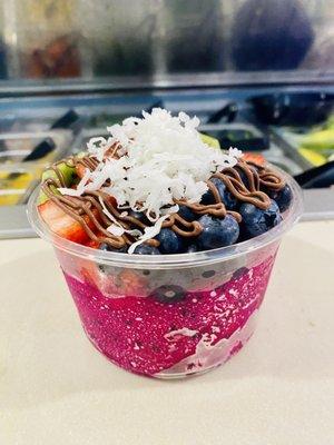 Açaí bowl - a build your own bowl- with pitaya (dragonfruit) fruits and toppings.