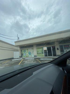 Outside look of the shopping center. Next to a massage and gold buying place .