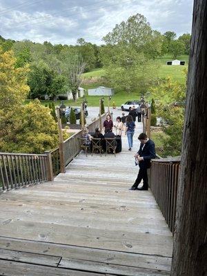 Staircase leading up to the main hall that crosses a creek