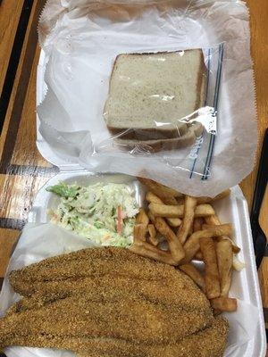 Catfish filet dinner with French fries, coleslaw, and couple slices of bread. Yes there are 3 pieces of fish there. Yum.