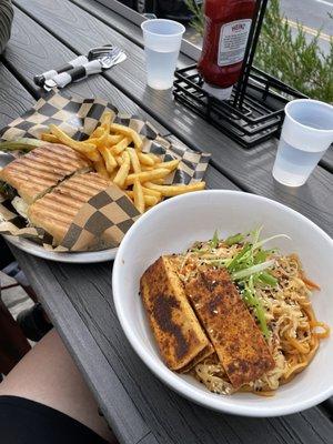 Tomato mozzarella panini with french fries and the spicy peanut noodle bowl with tofu.