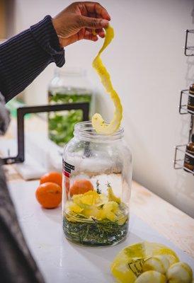 Making our citrus and herb infused vinegar