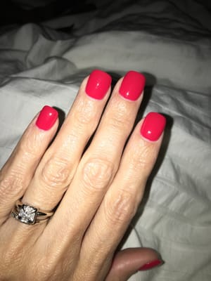 Beautiful color! Hard to tell. It's Essie: Too Too Hot.