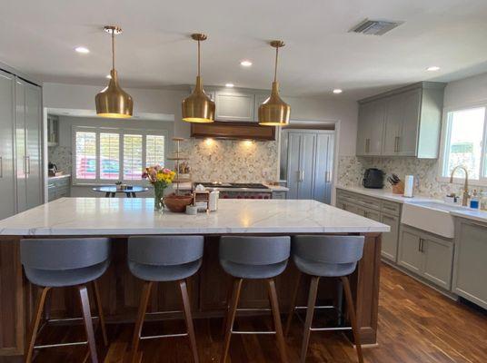 Kitchen remodel with installation of new pendants, recessed and under cabinet lighting.