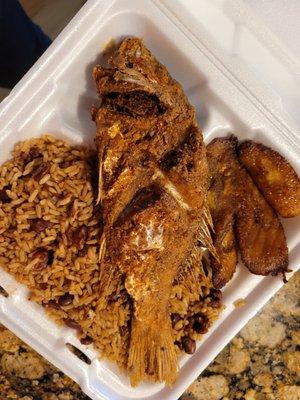 Red snapper, peas and rice and plantain close-up.