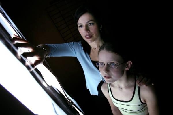 Physical Therapist and Owner Cindy Marti works with a young scoliosis patient