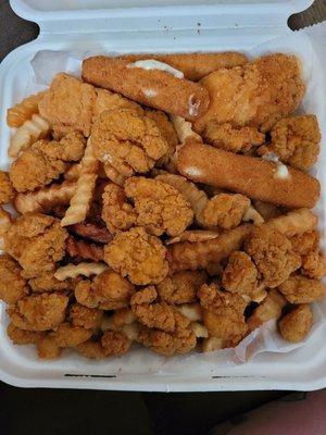 Appetizer plate. Fries, mozzarella sticks,  chicken tenders and popcorn chicken