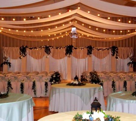 Canopy Ceiling draded in white shear fabric, lights and chandeliers