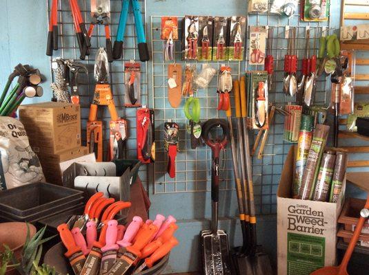 Tools, fertilizers, non-toxic pest repellents, and other gardening supplies.