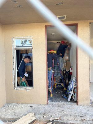 Literally torn down the front door while we were in the building all construction with NO permits.