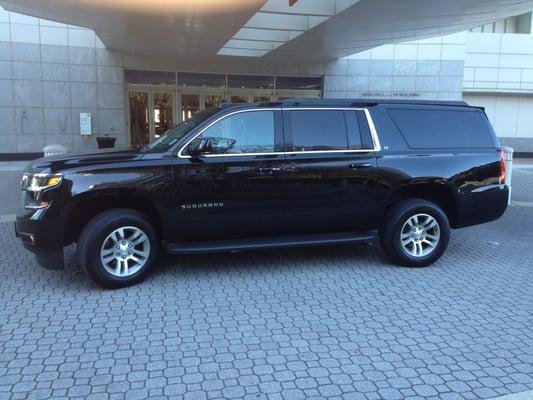 Black Chevy Suburban. Seat Belts for riding 7 Passengers and luggage.