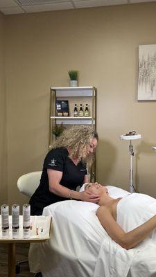 Elevate Wellness Med Spa - Esthetician Wendy Rogers providing a 5 star facial to a customer