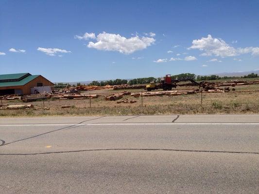 Side yard of lumber as seen from the highway.