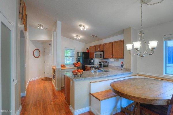 Remodeled wall and partition, added built in banquette, Quartz countertops w/ peninsula, under mount sink, butcher block island and more.