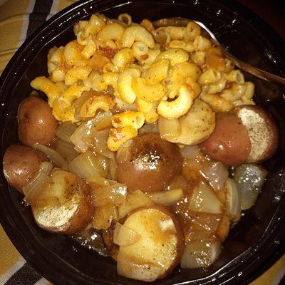 Salisbury steak with seasoned potatoes caramelized onions and macaroni and cheese