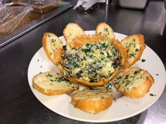 Spinach artichoke dip with a parmasean crisp bowl.