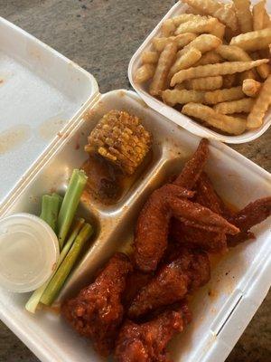 Fries and 6-Piece Buffalo Wings comes with ranch, celery, and corn.