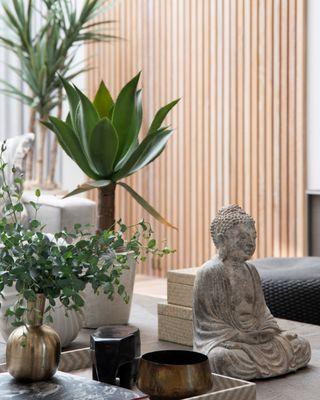 Pops of live green foliage give vitality and a Zen-like feeling to beiges and cool neutral grays.