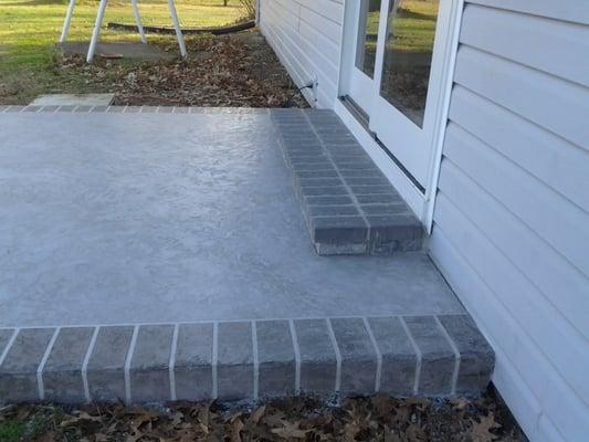 Old patio after overlay with new brick step !