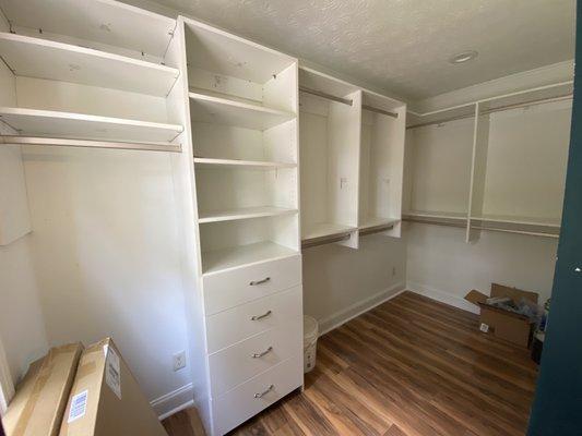 A master closet was installed by adding a wall at the end of our long bedroom. A barn door was installed and shelving as shown here.