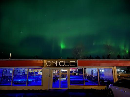 On Cue, blacklight billiard night with the aurora borealis overhead