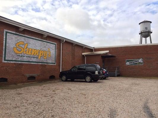 Store entrance in a low brick warehouse building