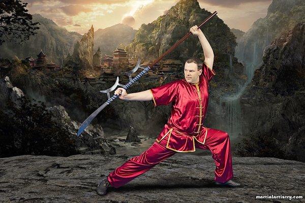 Martial Artistry Shaolin Kung Fu and Chinese Wushu student Jonathan Milton poses with the horse cutter, a Chinese martial arts weapon.