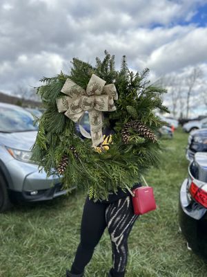 Decorated wreath with pines.