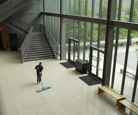 Operations Manager dust mopping an important museum in the DFW area.