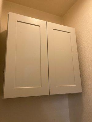 Bathroom cabinet above the toliet