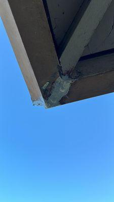 Gutter joint repair - fixing a rusted seam with a large gap.