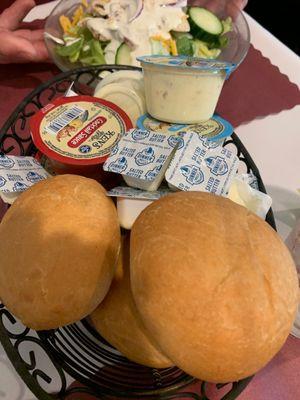 Complimentary bread basket with cocktail and tarter sauce you won't need.