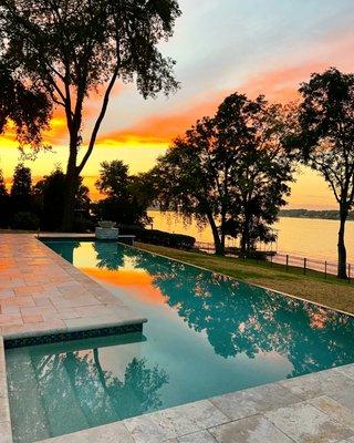 What a beautiful sunrise our client has on the lake! This pool is a gunite pool with infinity edge