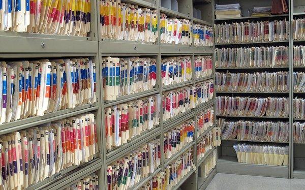 Rows of medical files that need to be shredded