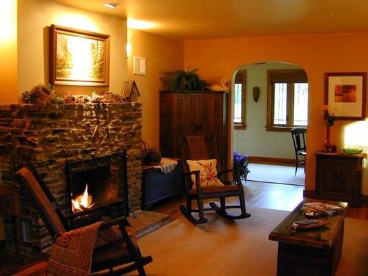 Living Room with gas log fireplace for instant ambiance and warmth from the luxurious leather couch.