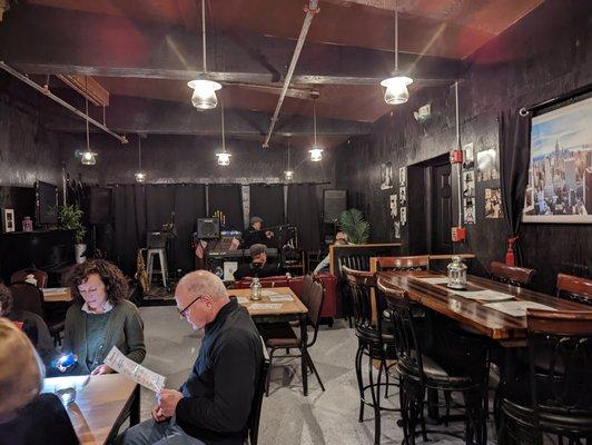 Interior, seated directly in front of the bar