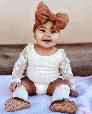 Long sleeve cream colored onesie and knee-high socks