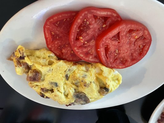 Build your own omelette with sausage bacon and mushrooms.