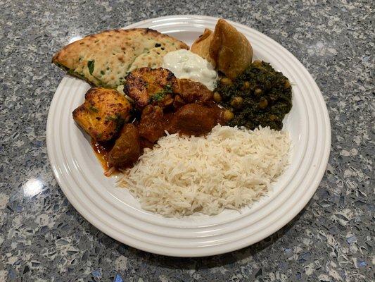 Jalapeno Naan, Tandoori Chicken Tikka, Vegetable Samosa, Lamb Rogan Josh Curry, Channa Saag (Vegan), and Cucumber Raita.