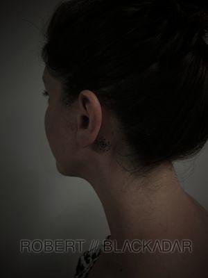 Dots behind the ear by Robert