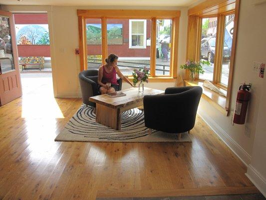 A beautiful spalted maple coffee table in a sunny nook at Vermont Tree Good's showroom