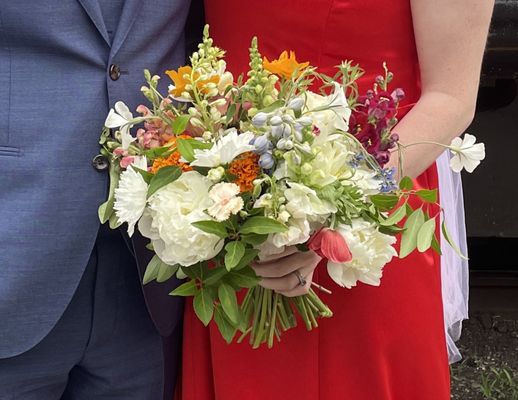 wedding bouquet with a mix of white flowers and colorful ones