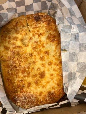 "Fresh two hour old cheesy bread".