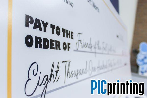 Big check designed and printed for our partners at SMPS Fort Worth!