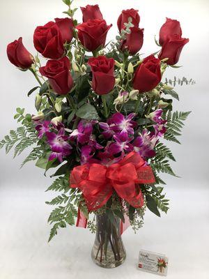 A dozen long stem red roses with Dendrobium orchids