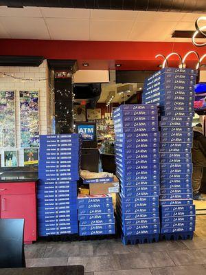 Stacked pizza boxes add to the decor